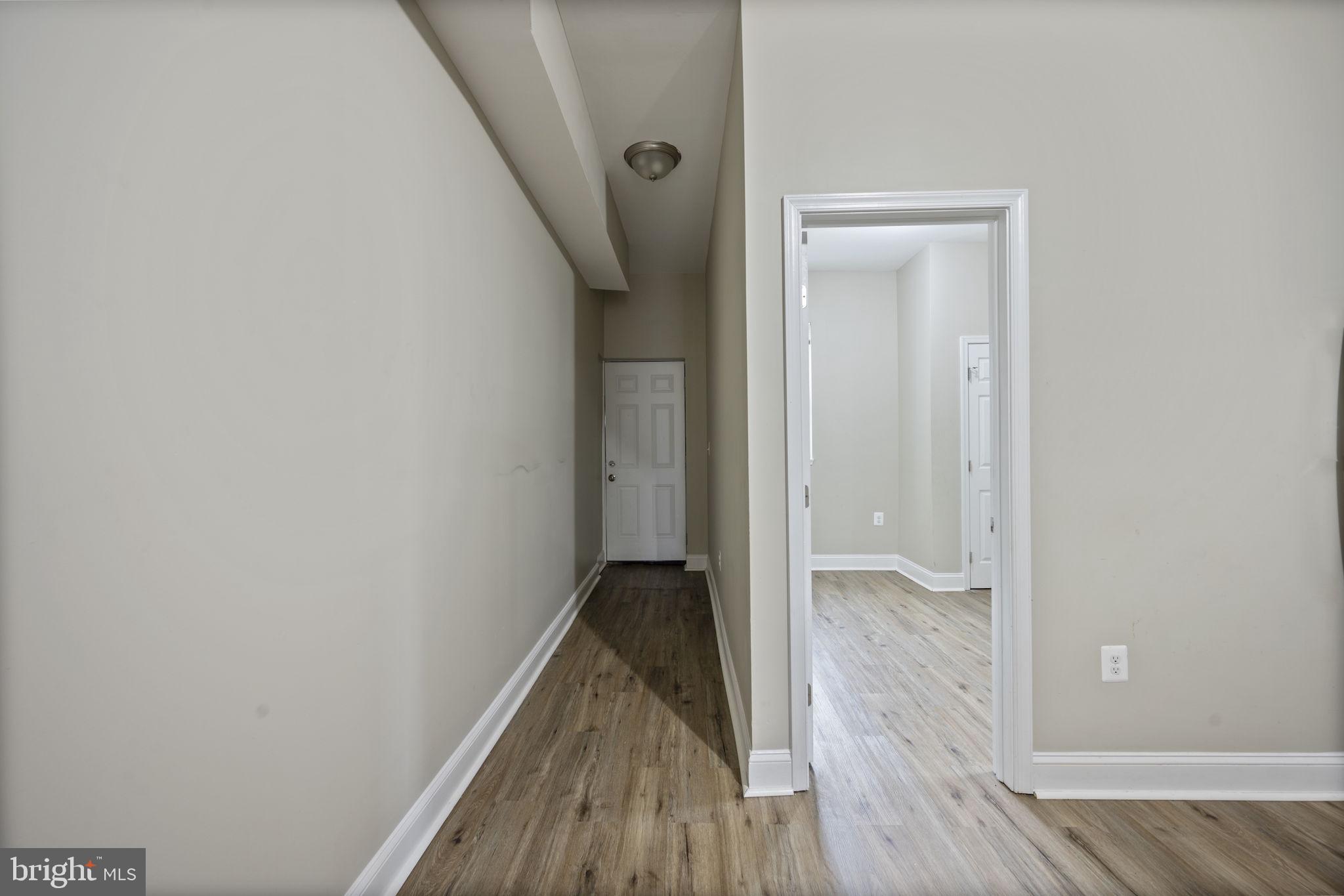 3619 Cottage Avenue Baltimore, MD 21215 - Photo 12 of 31 a view of hallway with wooden floor