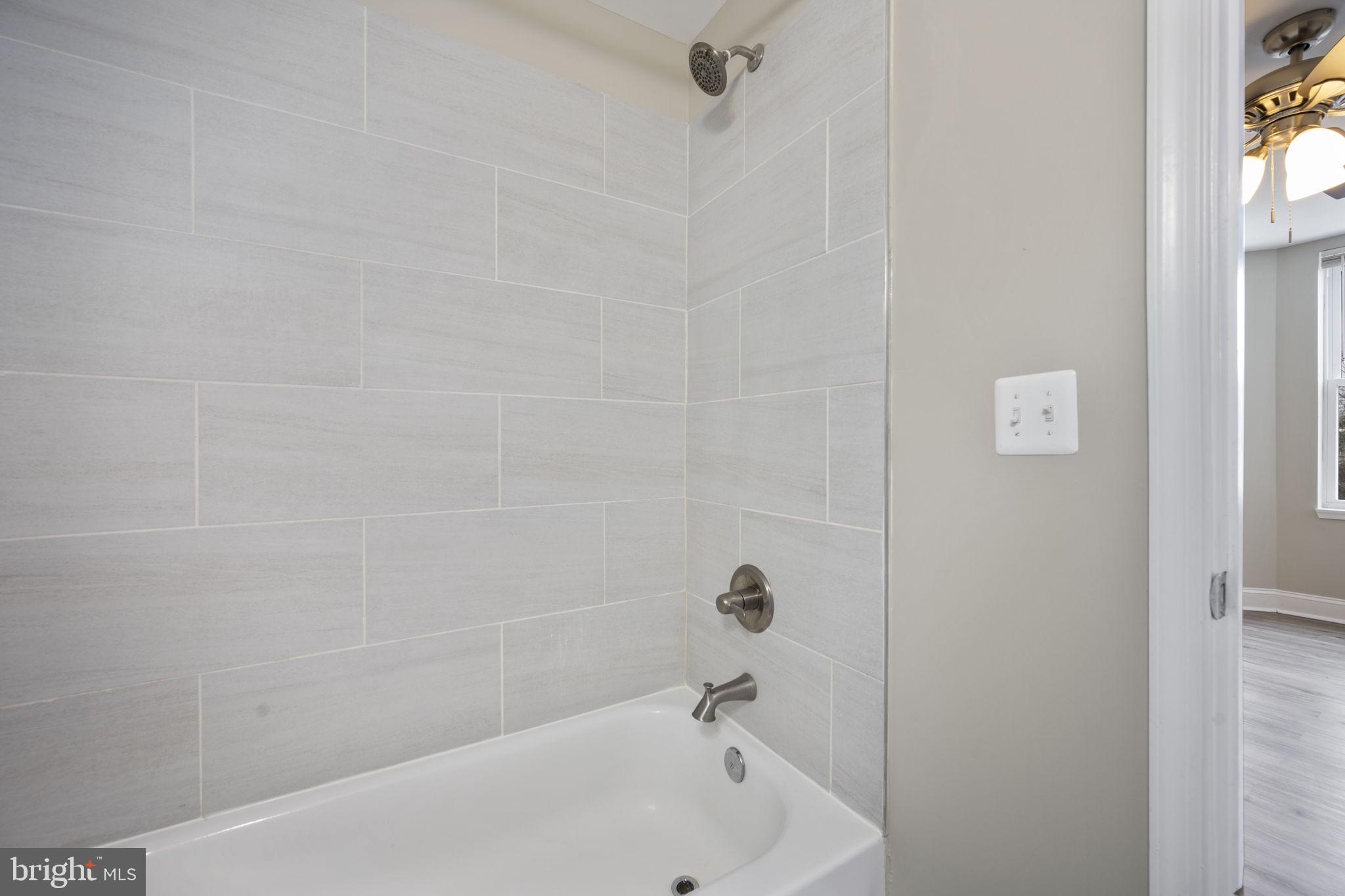 3619 Cottage Avenue Baltimore, MD 21215 - Photo 23 of 31 a bathroom with a bathtub