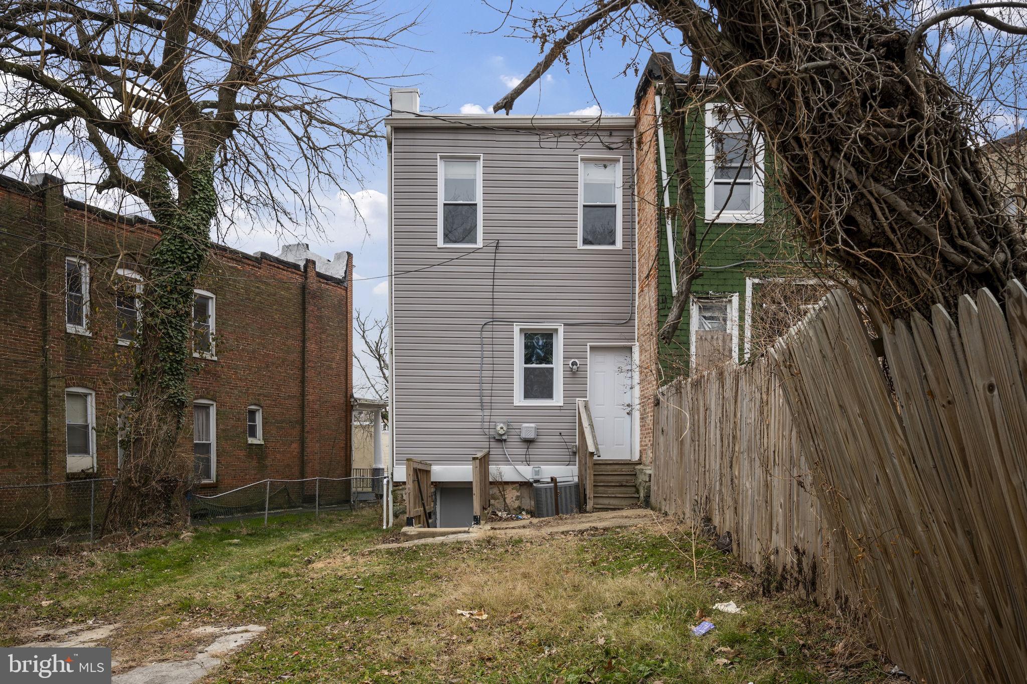 3619 Cottage Avenue Baltimore, MD 21215 - Photo 29 of 31 front view of a house with a yard