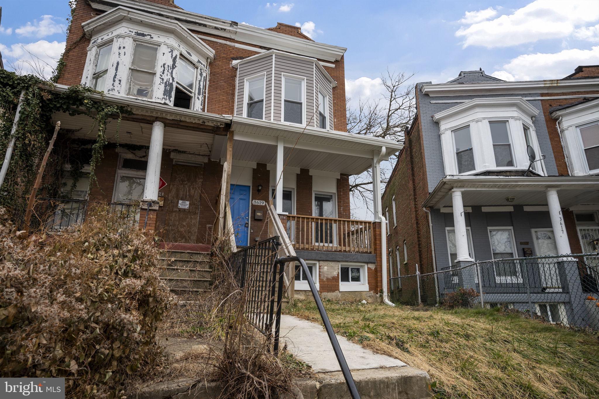 3619 Cottage Avenue Baltimore, MD 21215 - Photo 4 of 31 front view of a house with a yard