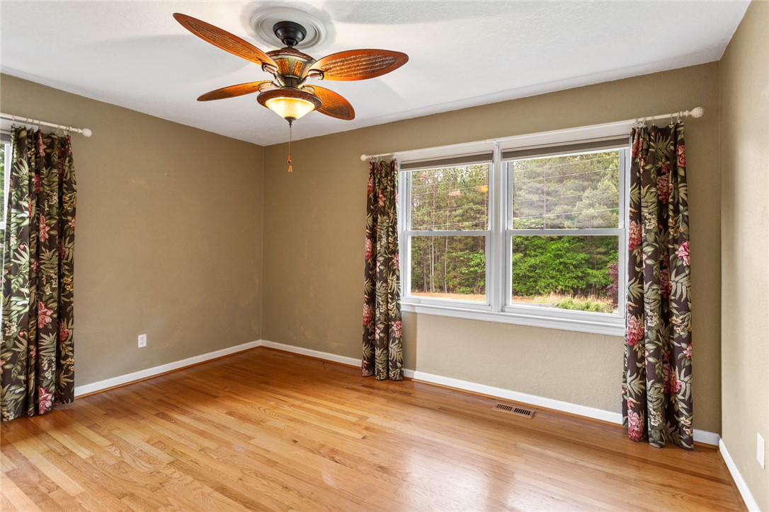 202 Keowee Trail Seneca, SC 29672 - Photo 16 of 35 This spacious room features hardwood floors and ample natural light, ideal for peaceful living.