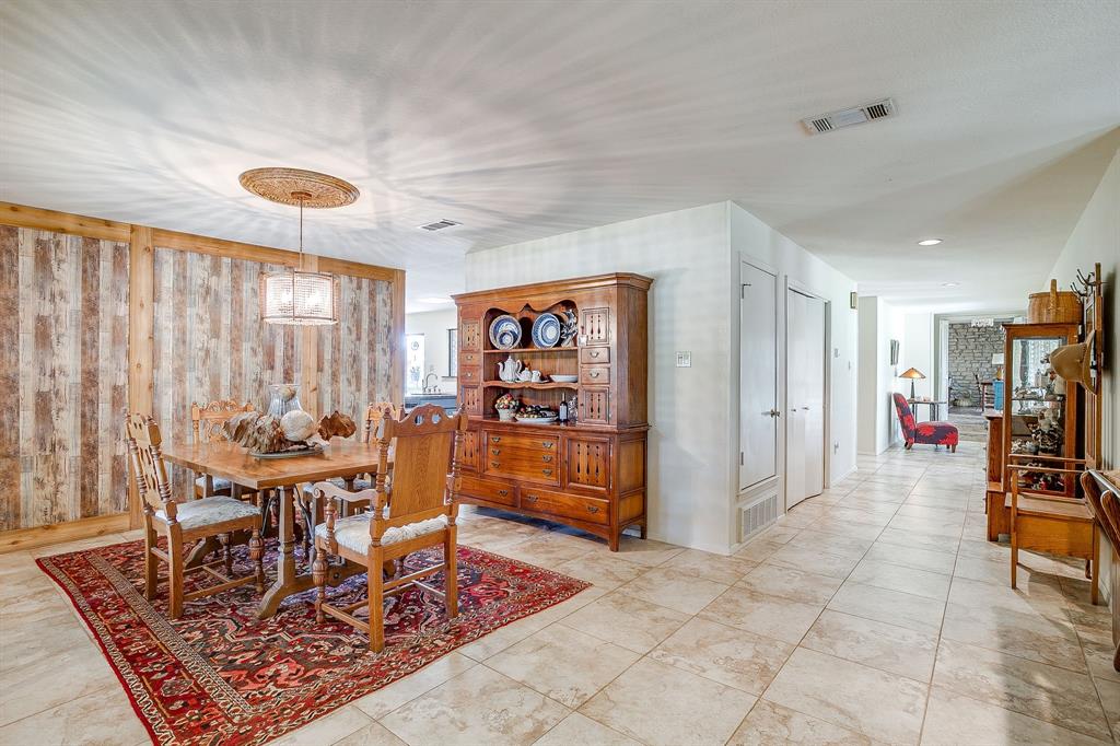 8918 Bellechase Road Granbury, TX 76049 - Photo 11 of 38 a living room with furniture and a rug