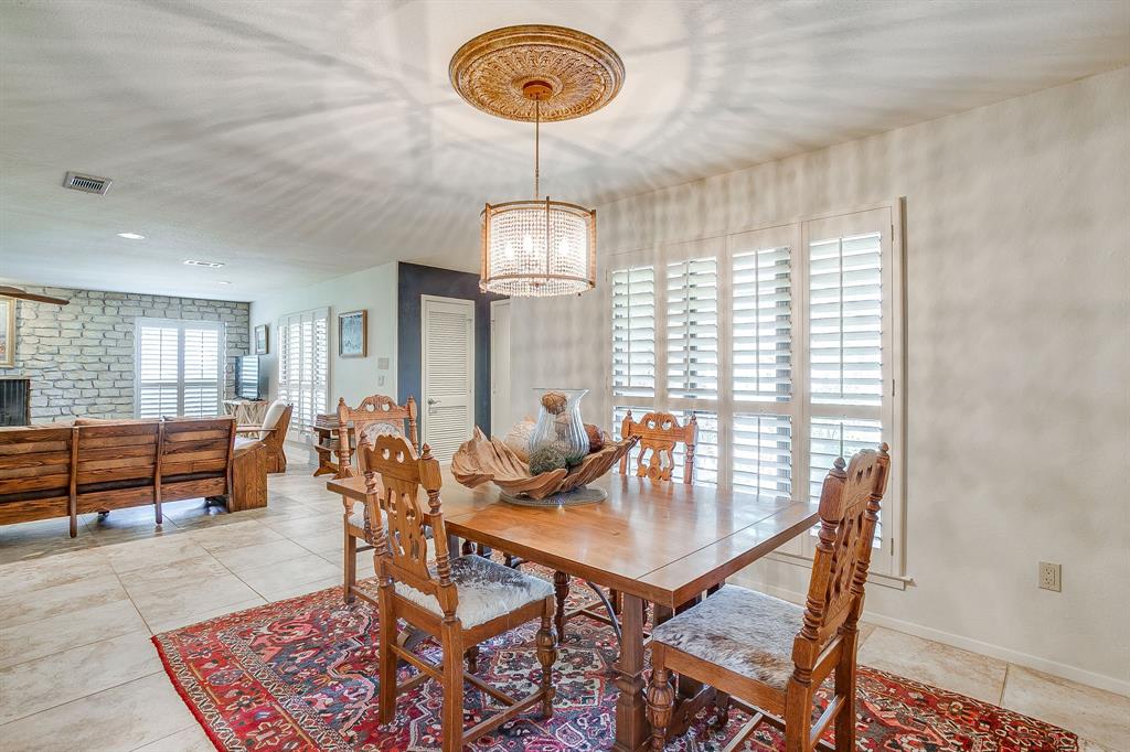 8918 Bellechase Road Granbury, TX 76049 - Photo 13 of 38 a dining room with furniture and window