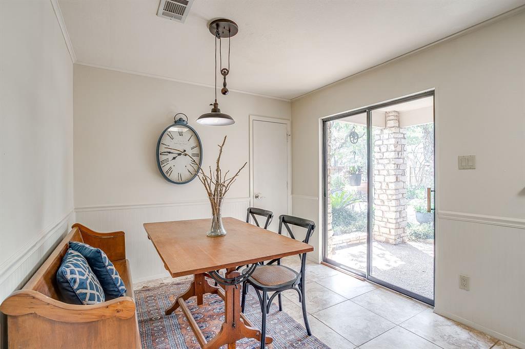 8918 Bellechase Road Granbury, TX 76049 - Photo 20 of 38 a view of a dining room with furniture window and wooden floor