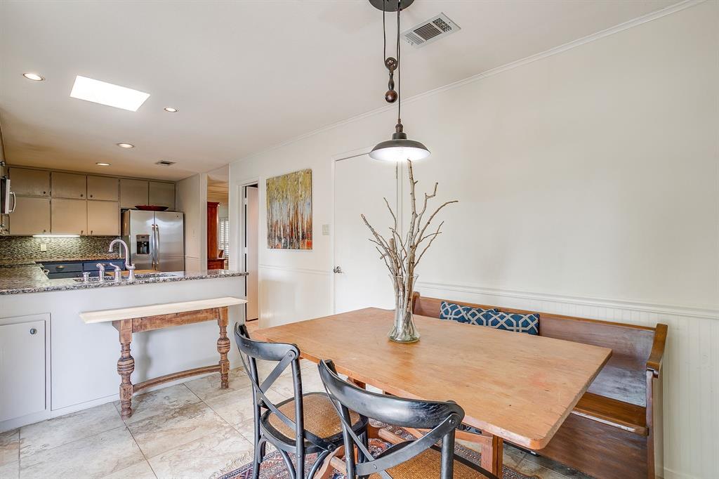 8918 Bellechase Road Granbury, TX 76049 - Photo 21 of 38 a view of a dining room with furniture and a chandelier