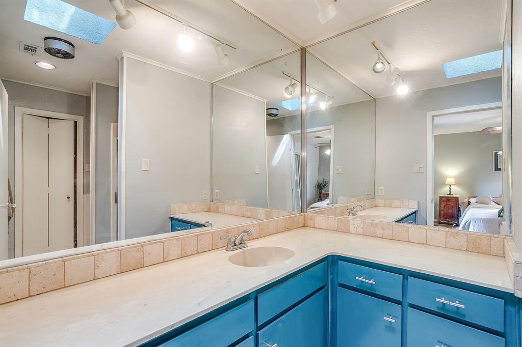 8918 Bellechase Road Granbury, TX 76049 - Photo 28 of 38 a bathroom with a sink double vanity and a mirror