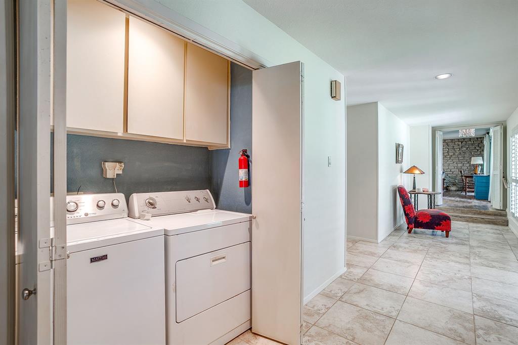 8918 Bellechase Road Granbury, TX 76049 - Photo 32 of 38 a view of storage and utility room with washer and dryer