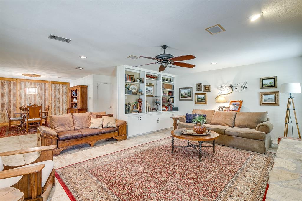 8918 Bellechase Road Granbury, TX 76049 - Photo 8 of 38 a living room with furniture and a large window