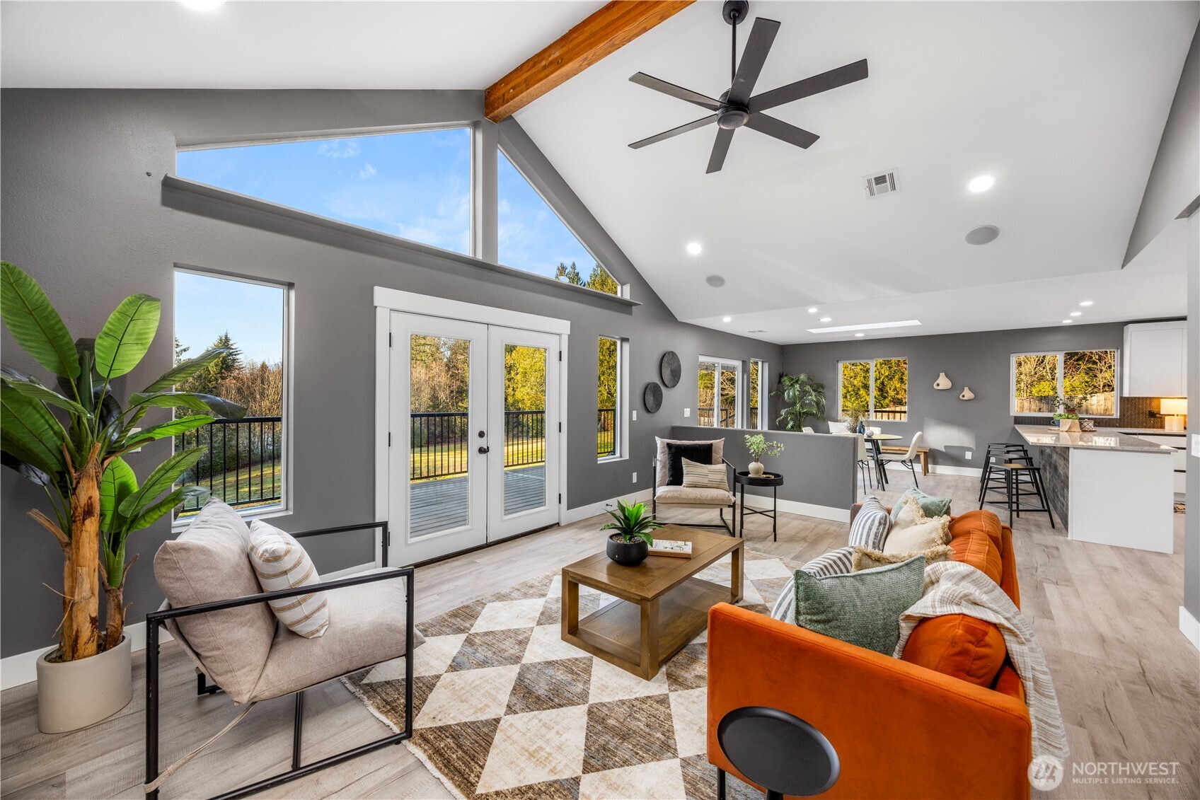 9371 Willamette Meridian Road Northwest Silverdale, WA 98383 - Photo 13 of 40 a living room with furniture a dining table and a potted plant