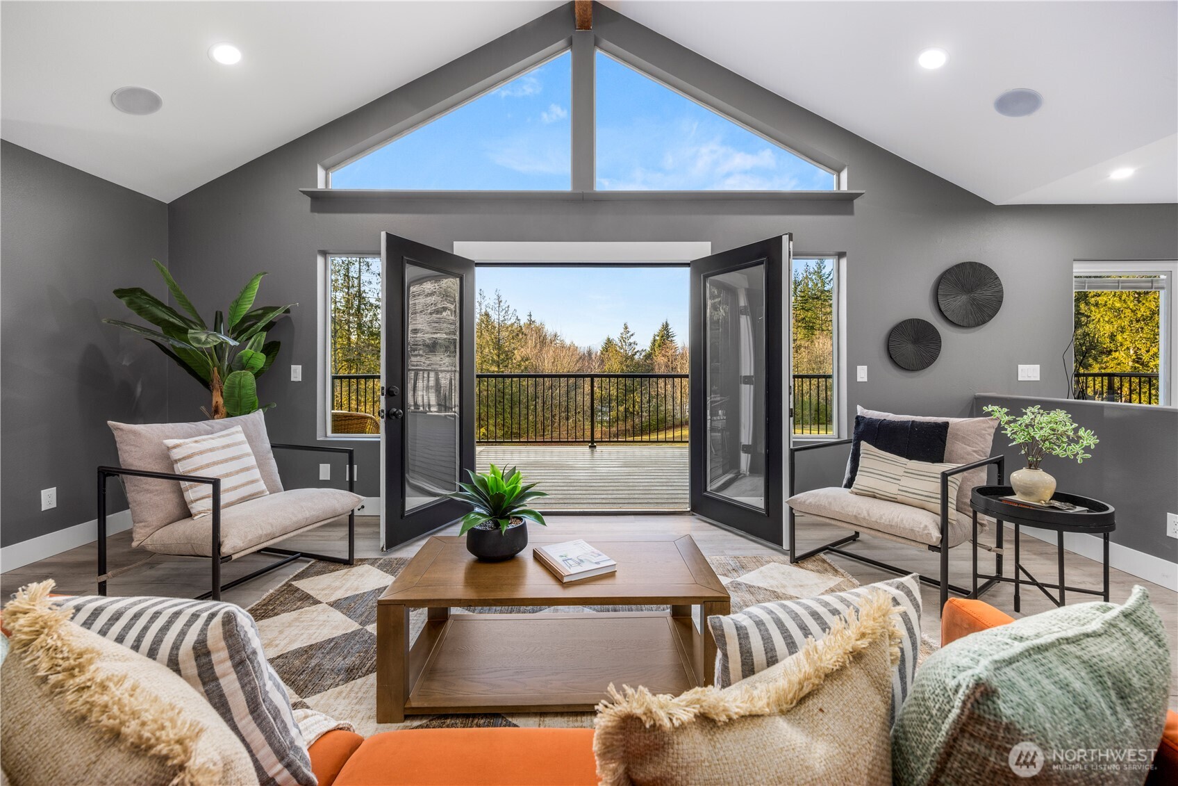 9371 Willamette Meridian Road Northwest Silverdale, WA 98383 - Photo 14 of 40 a living room with furniture and a large window