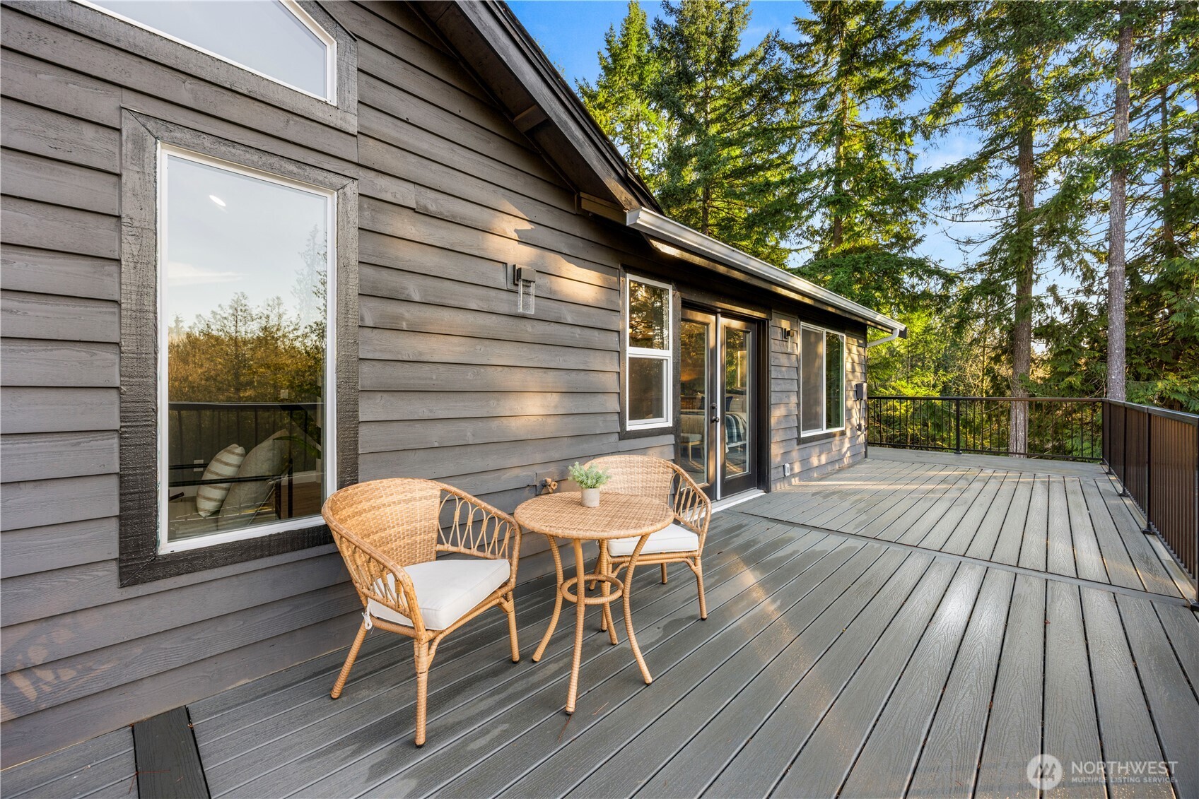 9371 Willamette Meridian Road Northwest Silverdale, WA 98383 - Photo 15 of 40 a view of backyard with a deck and wooden floor