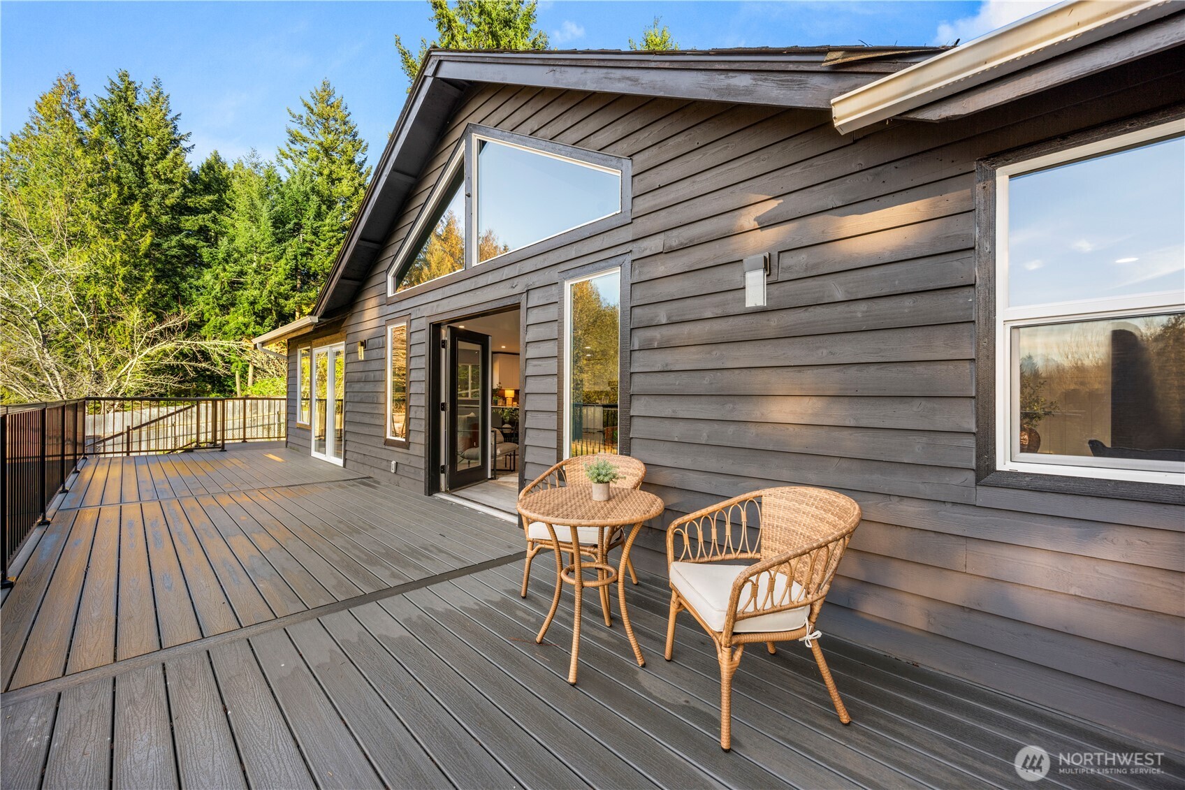 9371 Willamette Meridian Road Northwest Silverdale, WA 98383 - Photo 16 of 40 a view of a wooden chairs on the roof deck