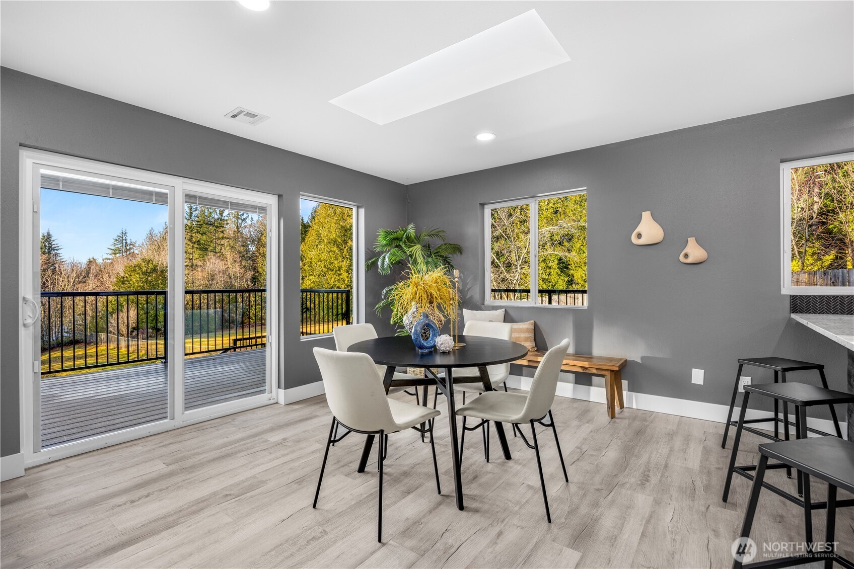 9371 Willamette Meridian Road Northwest Silverdale, WA 98383 - Photo 18 of 40 a view of a dining room with furniture window and outside view
