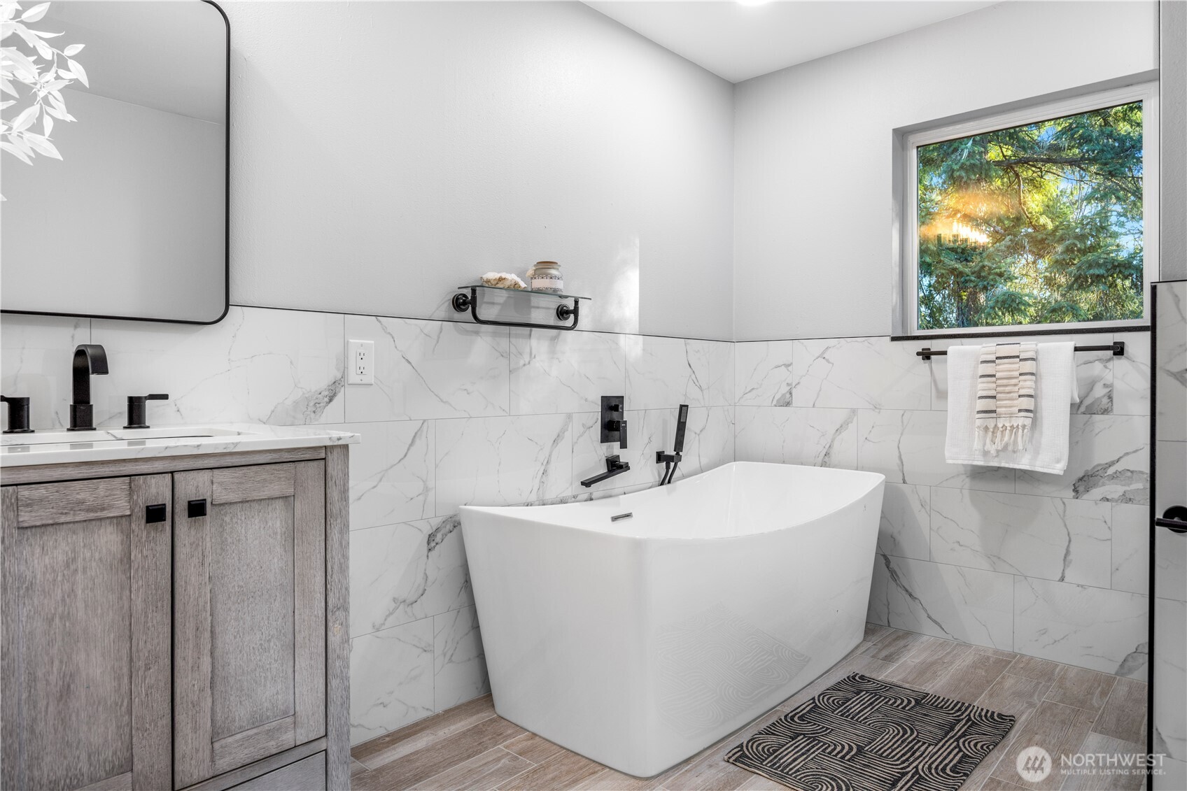 9371 Willamette Meridian Road Northwest Silverdale, WA 98383 - Photo 25 of 40 a white bath tub sitting next to a white sink