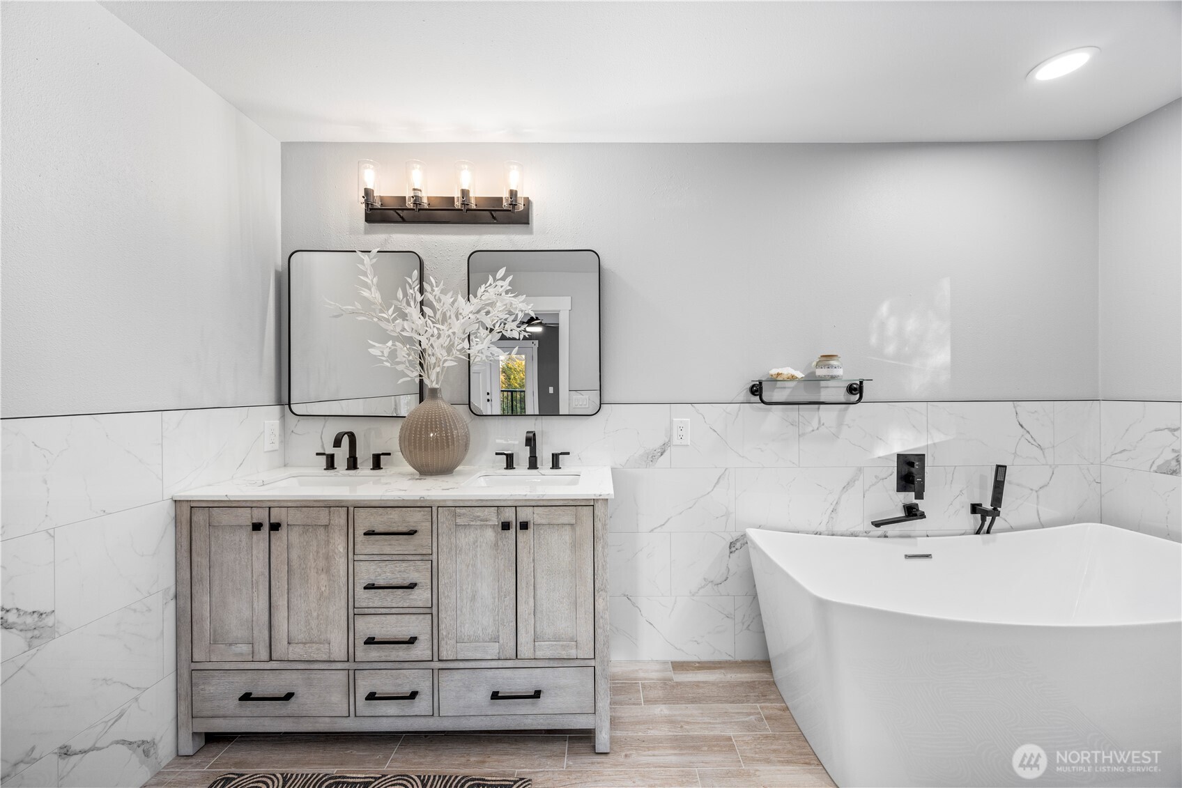 9371 Willamette Meridian Road Northwest Silverdale, WA 98383 - Photo 26 of 40 a bathroom with a double vanity sink mirror and