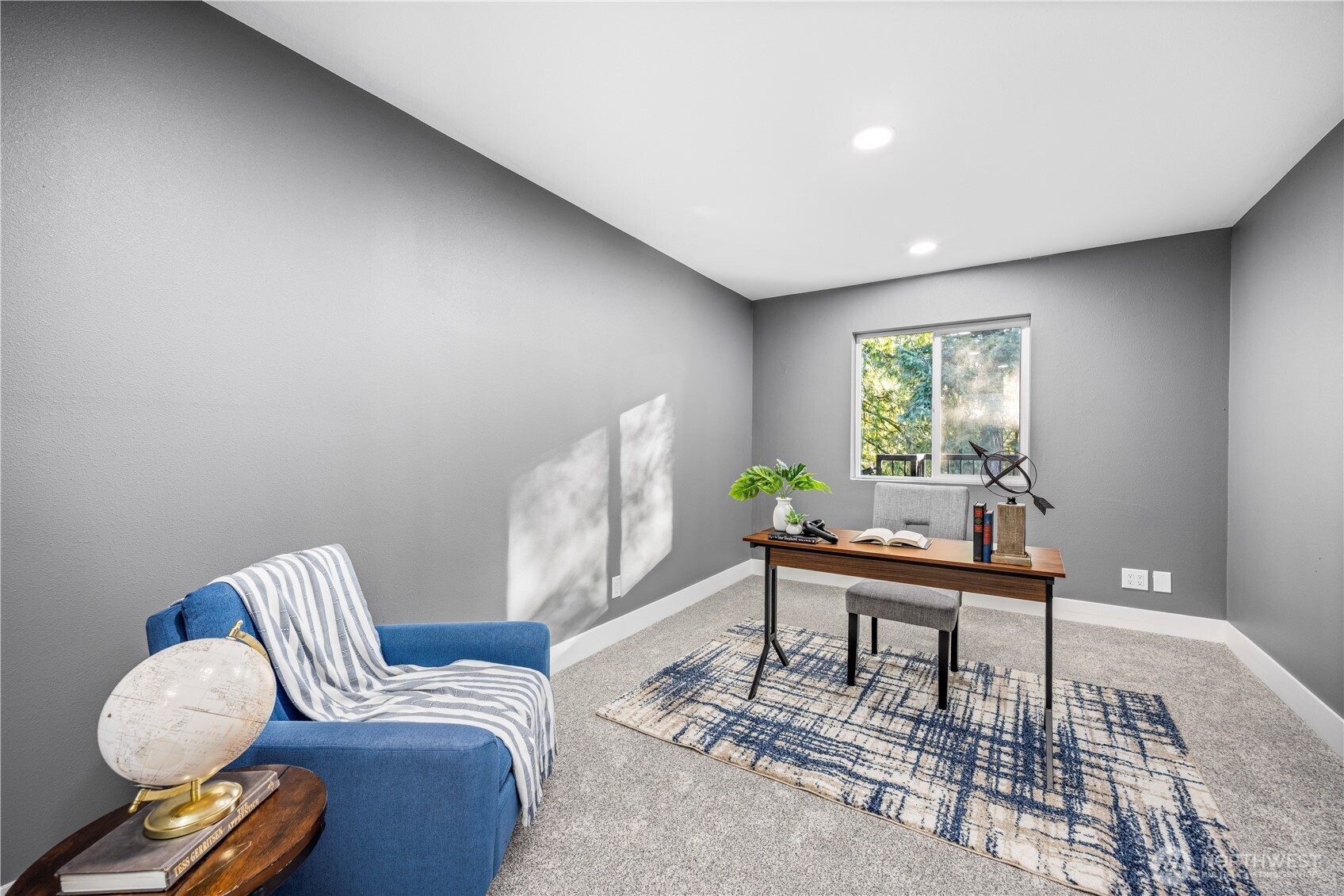 9371 Willamette Meridian Road Northwest Silverdale, WA 98383 - Photo 30 of 40 a living room with furniture and a window