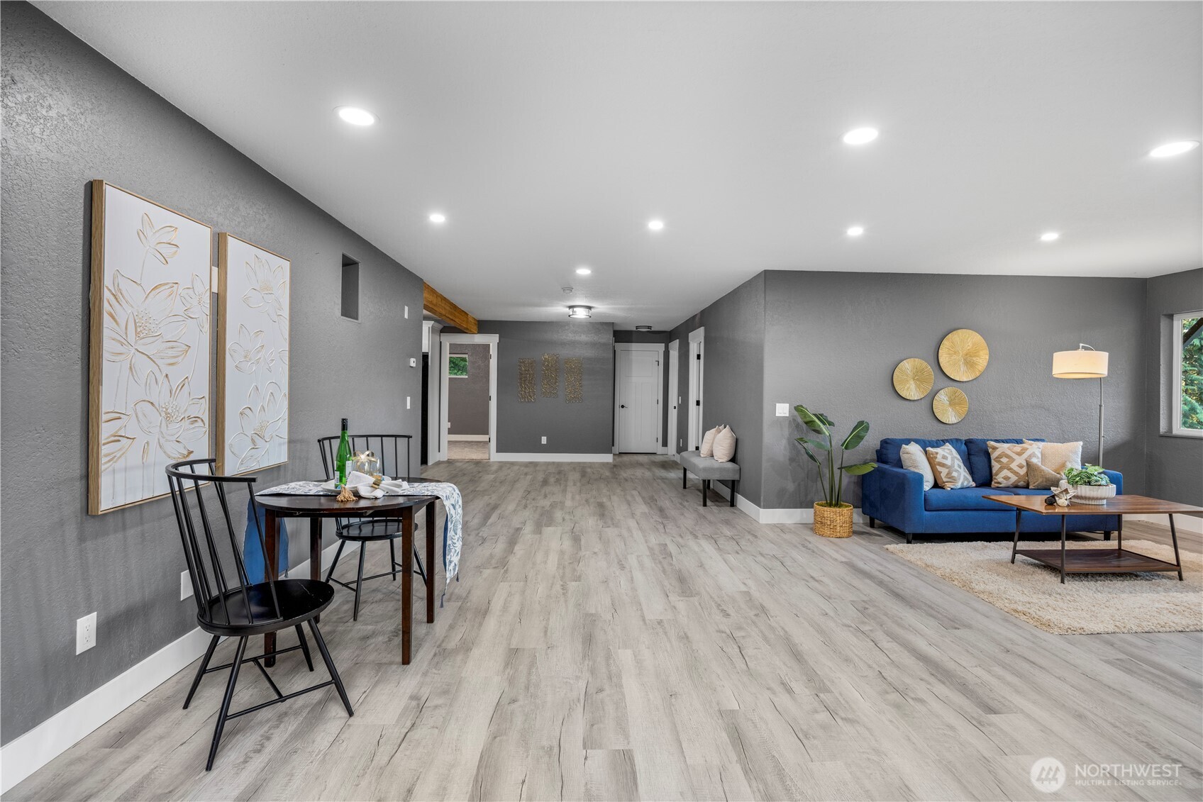 9371 Willamette Meridian Road Northwest Silverdale, WA 98383 - Photo 32 of 40 a living room with furniture and wooden floor