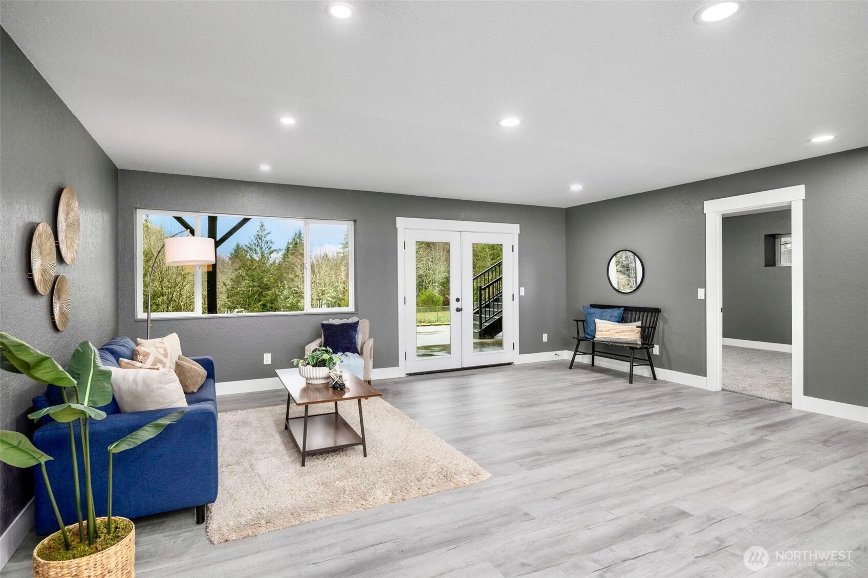 9371 Willamette Meridian Road Northwest Silverdale, WA 98383 - Photo 33 of 40 a living room with furniture and a window