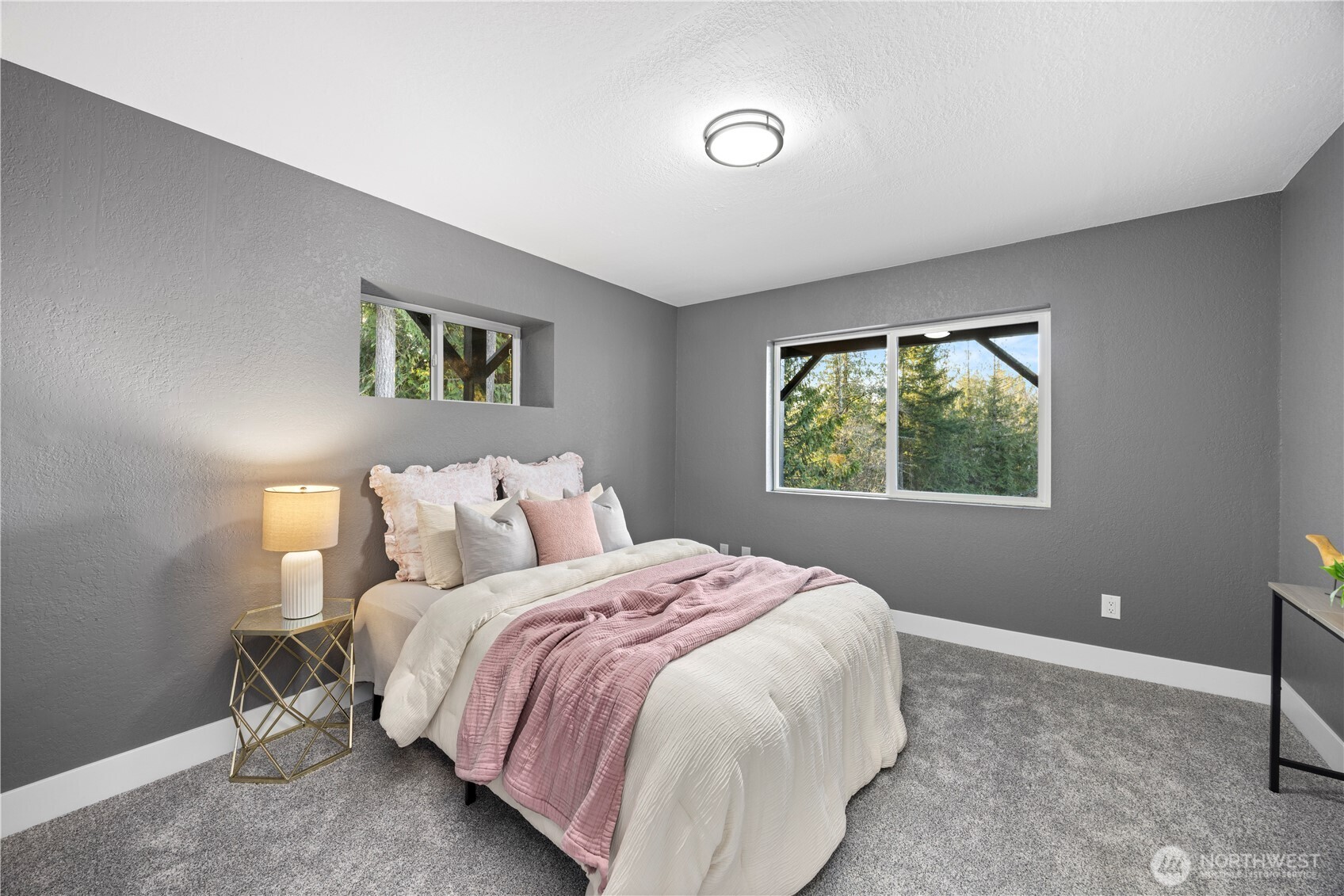 9371 Willamette Meridian Road Northwest Silverdale, WA 98383 - Photo 35 of 40 a bedroom with a bed and a window