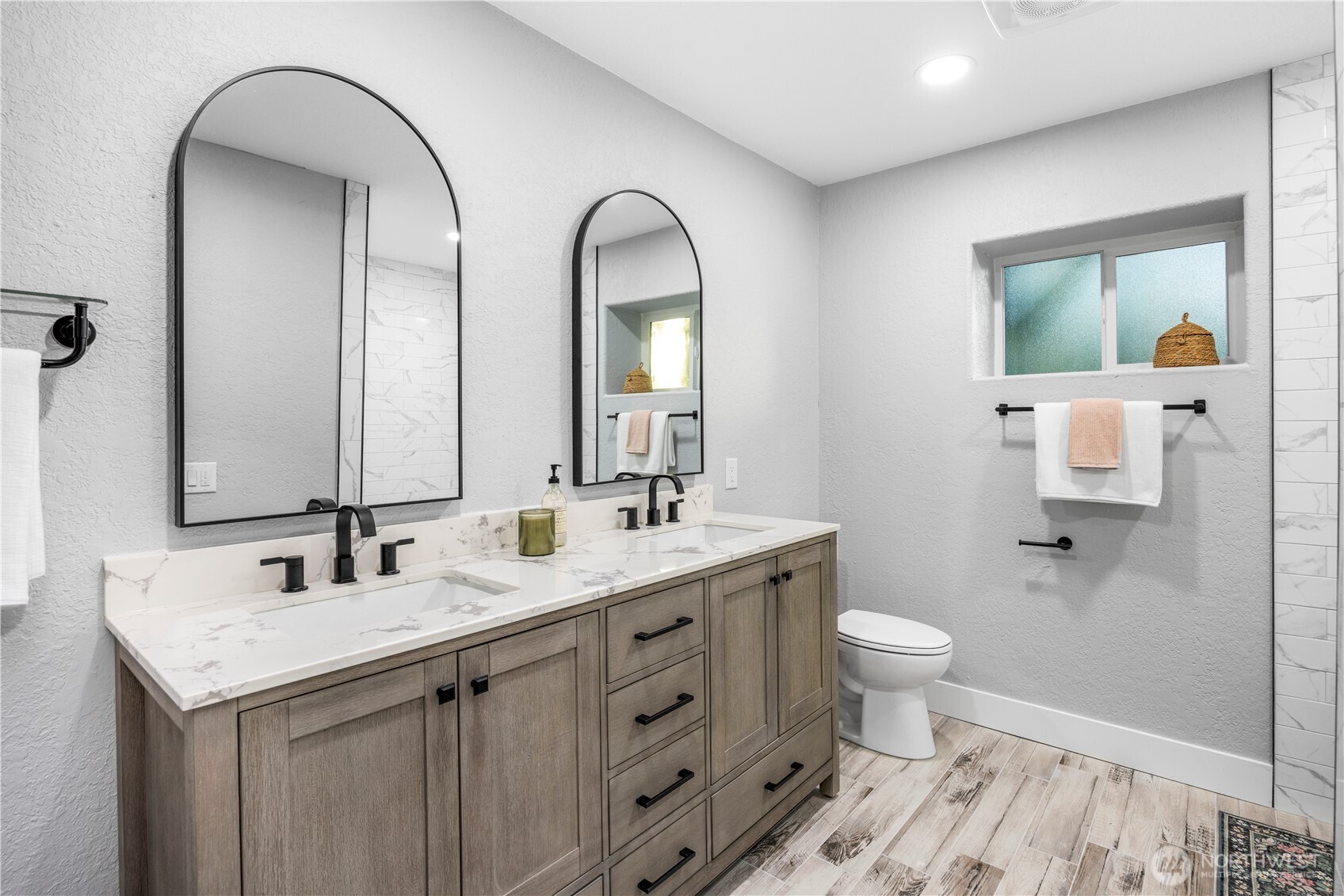 9371 Willamette Meridian Road Northwest Silverdale, WA 98383 - Photo 36 of 40 a bathroom with 2 sink and a mirror