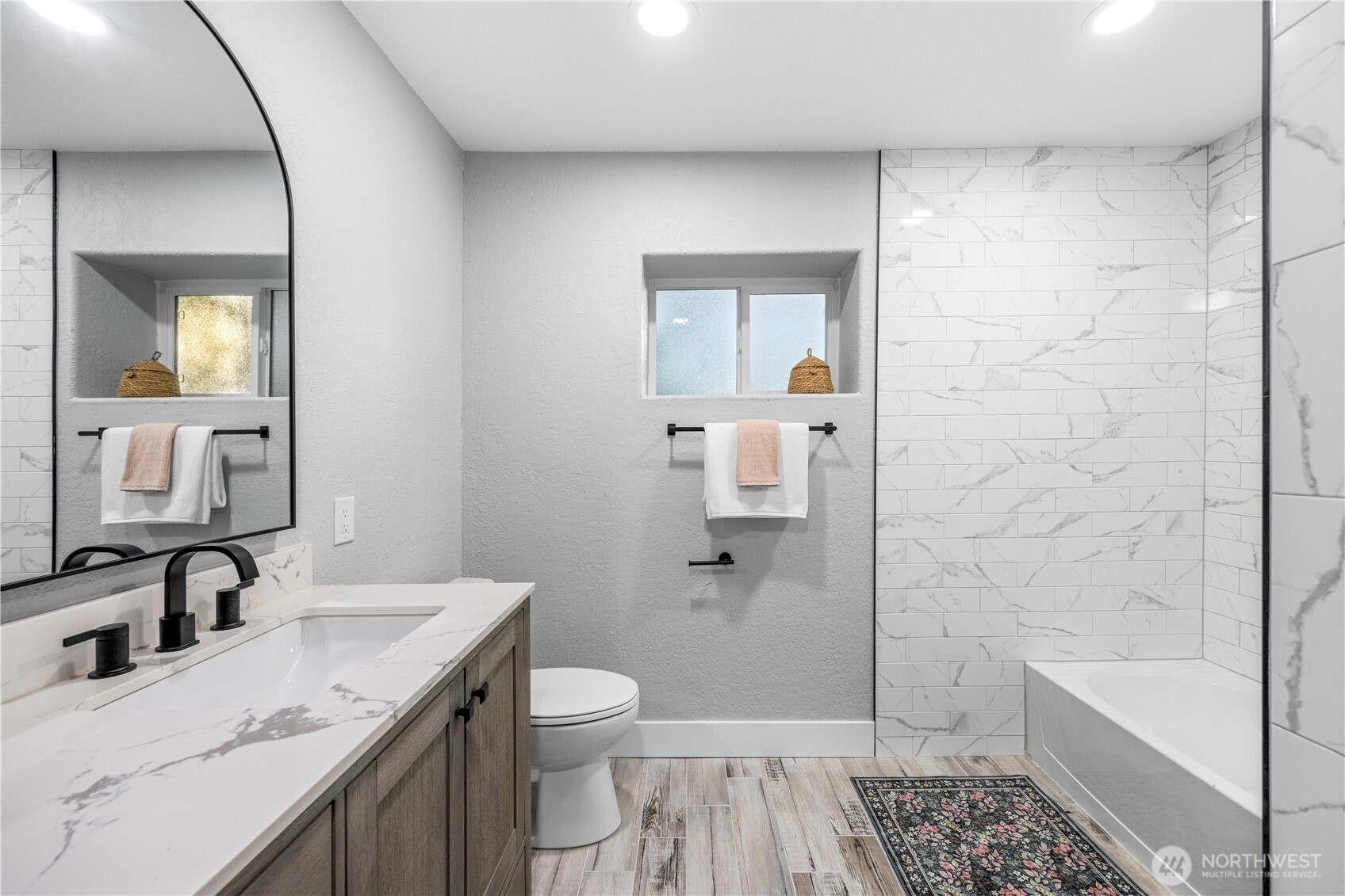 9371 Willamette Meridian Road Northwest Silverdale, WA 98383 - Photo 37 of 40 a bathroom with a granite countertop sink toilet and shower