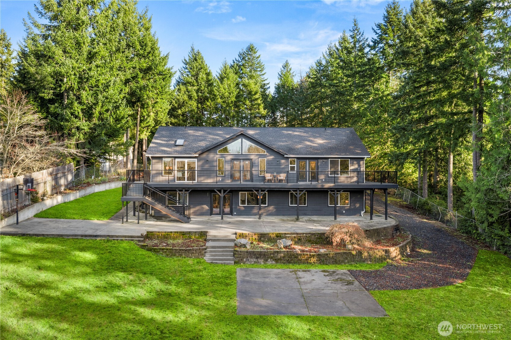 9371 Willamette Meridian Road Northwest Silverdale, WA 98383 - Photo 40 of 40 aerial view of a house with a yard table and chairs