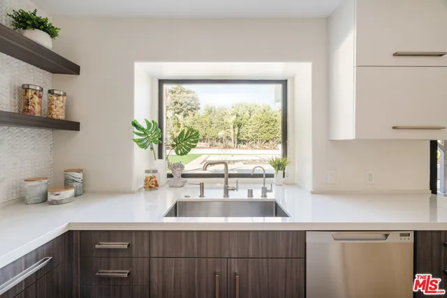 a kitchen with a sink and a window