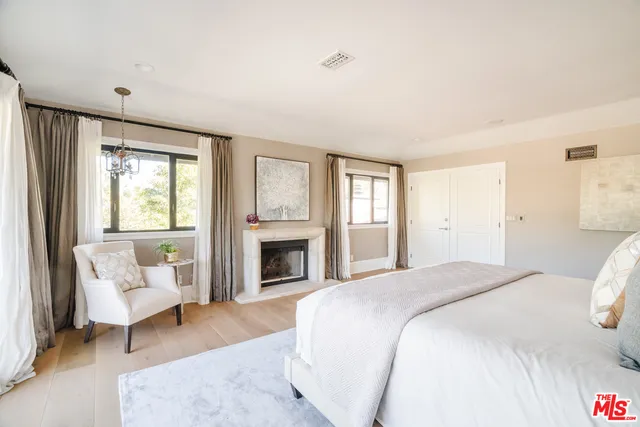 a spacious bedroom with a bed and a couch