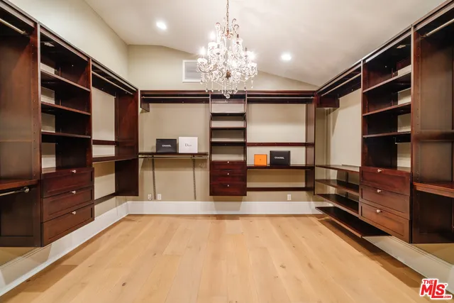 a view of kitchen with cabinets and window