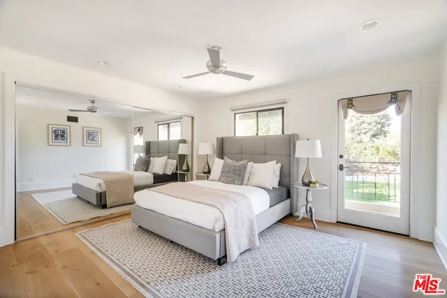 a bedroom with bed and a window