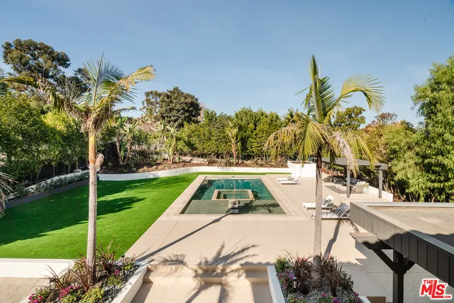 a view of swimming pool with a patio