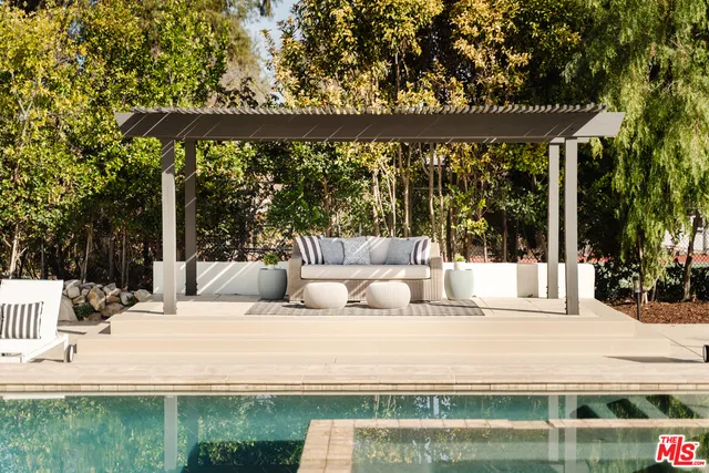 a view of swimming pool with patio