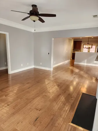 a view of an empty room and a window