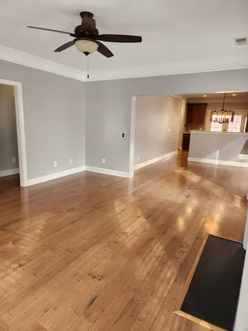 a view of an empty room and a window