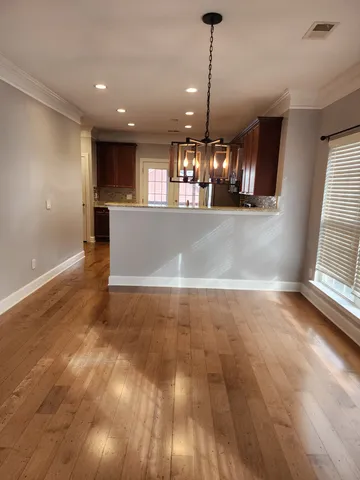 a kitchen with stainless steel appliances granite countertop a stove a sink dishwasher a refrigerator and a microwave oven