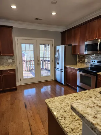 a view of a balcony with wooden floor