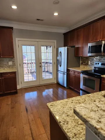 a view of a balcony with wooden floor