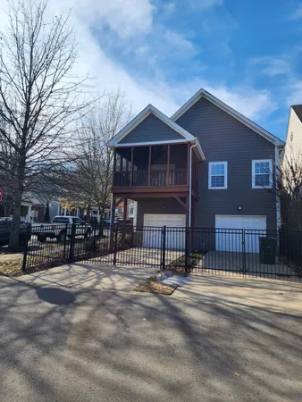 a front view of a house with a fence