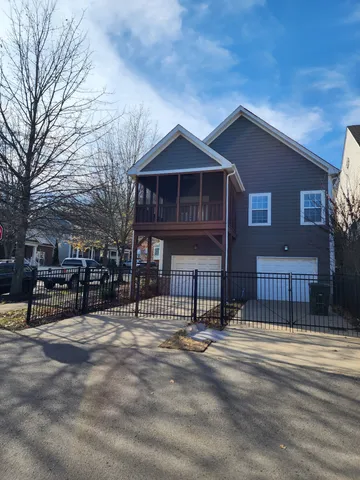 a front view of a house with a fence