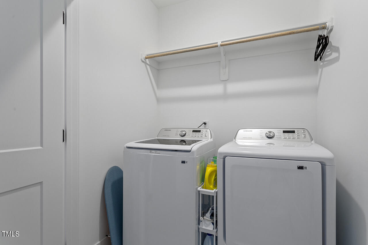 6504 Brecken Pnes Court Raleigh, NC 27612 - Photo 28 of 36 a utility room with dryer and washer