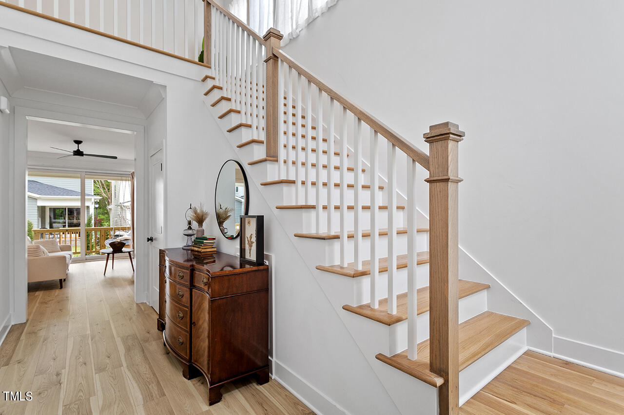 6504 Brecken Pnes Court Raleigh, NC 27612 - Photo 5 of 36 a view of entryway and hall with wooden floor