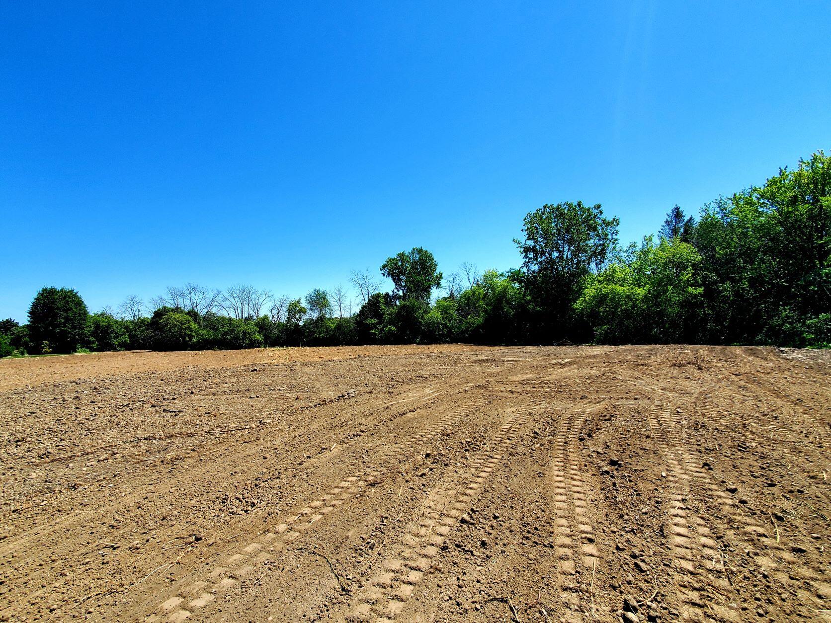 6507 Middle Road, Unit LT2 Caledonia, WI 53402 - Photo 1 of 1 middle rd lot 2 northeast tree line2