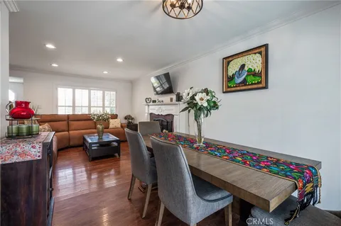 a living room with furniture and flowers