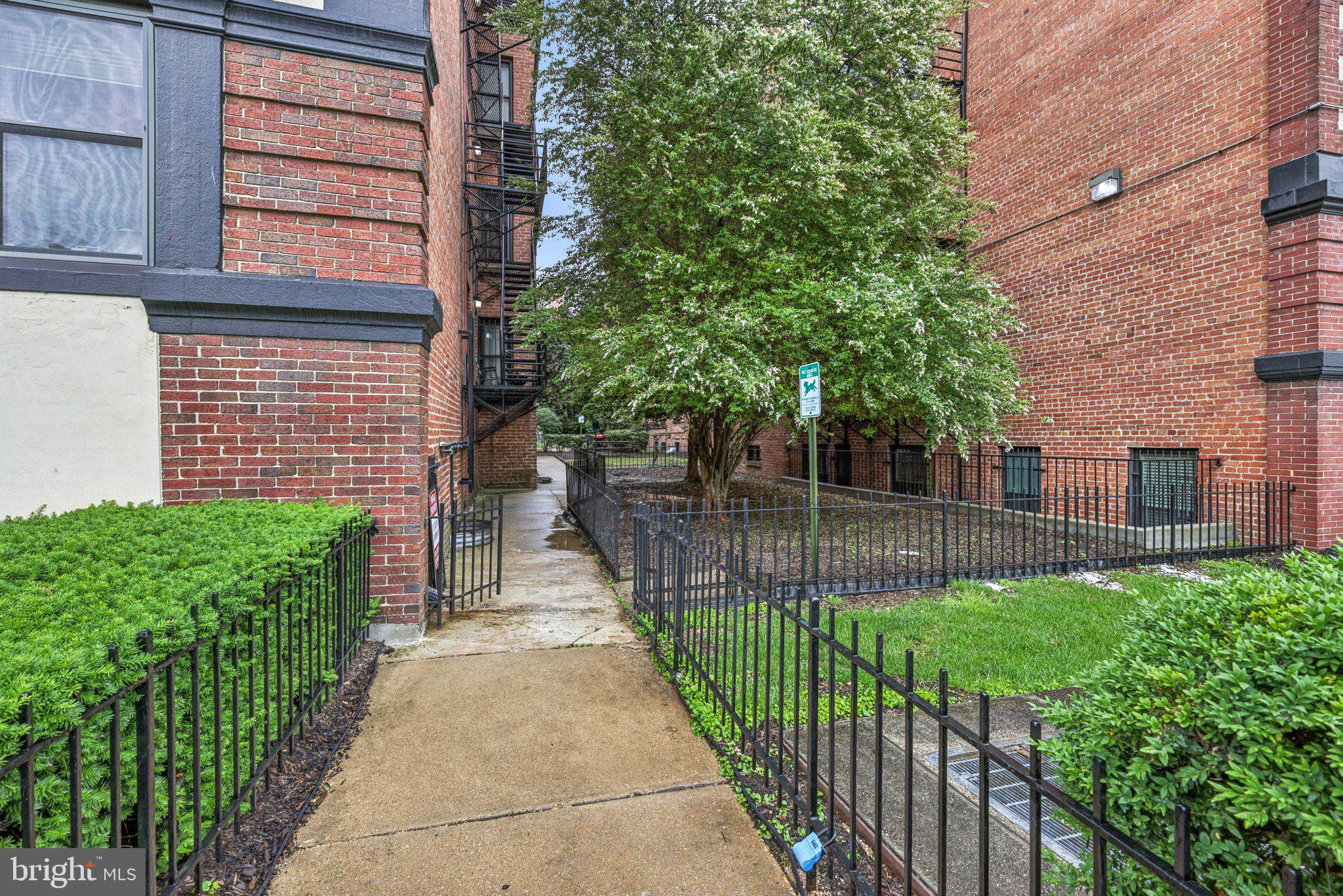1438 Meridian Place Northwest, Unit LL1 Washington, DC 20010 - Photo 16 of 18 a view of a house with a small yard