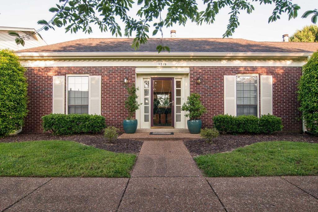 1219 General George Patton Road Nashville, TN 37221 - Photo 1 of 18 a front view of a house with garden