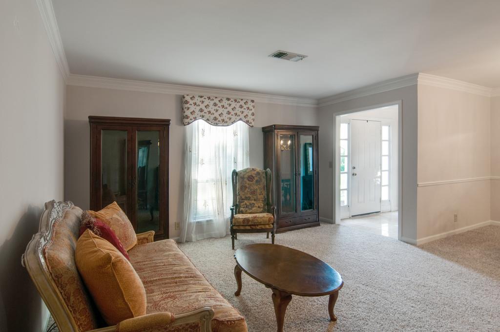 1219 General George Patton Road Nashville, TN 37221 - Photo 5 of 18 a living room with furniture and a chandelier
