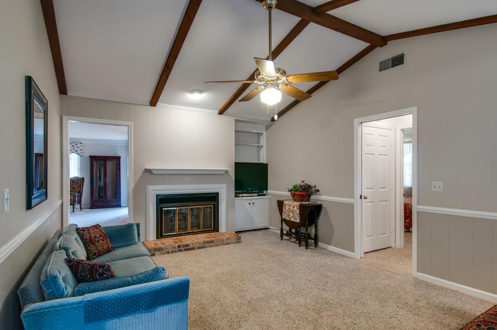 1219 General George Patton Road Nashville, TN 37221 - Photo 9 of 18 a living room with furniture and a fireplace
