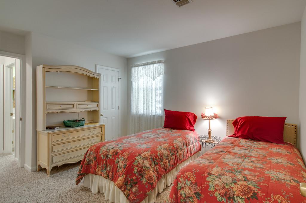 1219 General George Patton Road Nashville, TN 37221 - Photo 10 of 18 a bedroom with two beds and painted walls