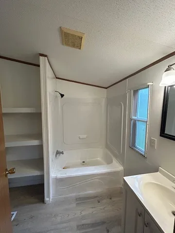 a bathroom with a bathtub and a sink
