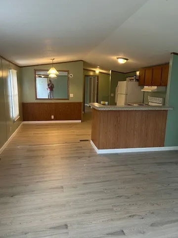 a view of kitchen and wooden floor